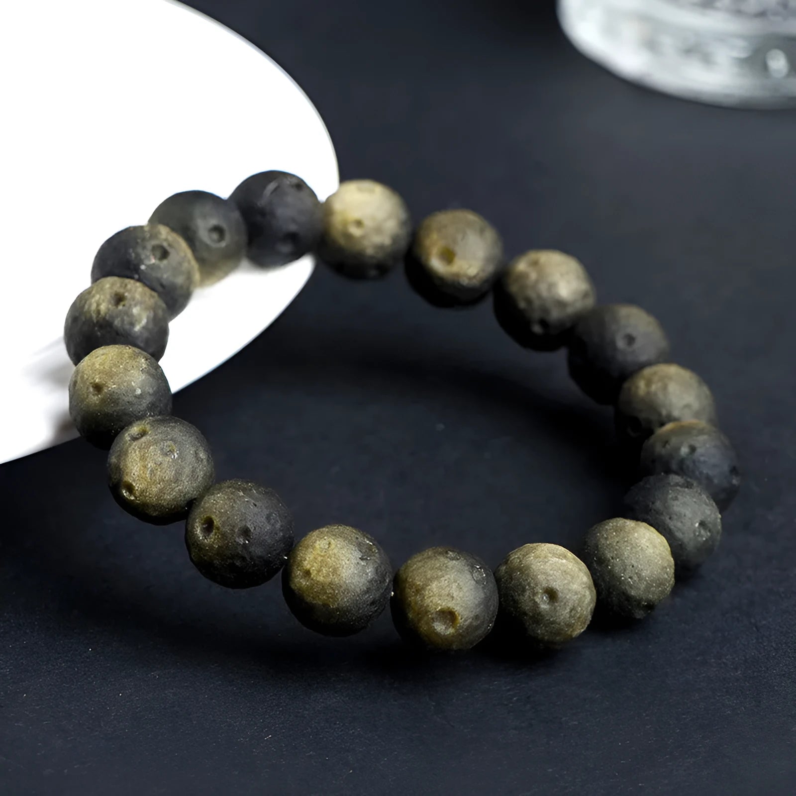 Obsidian crater ball bracelet with natural grinding texture in silver stone meteorite colour