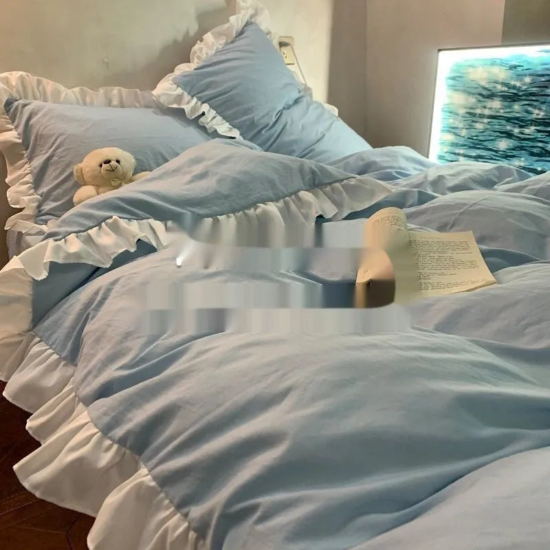 Mori style solid colour washed cotton bedding four-piece set with quilt cover on a bed.