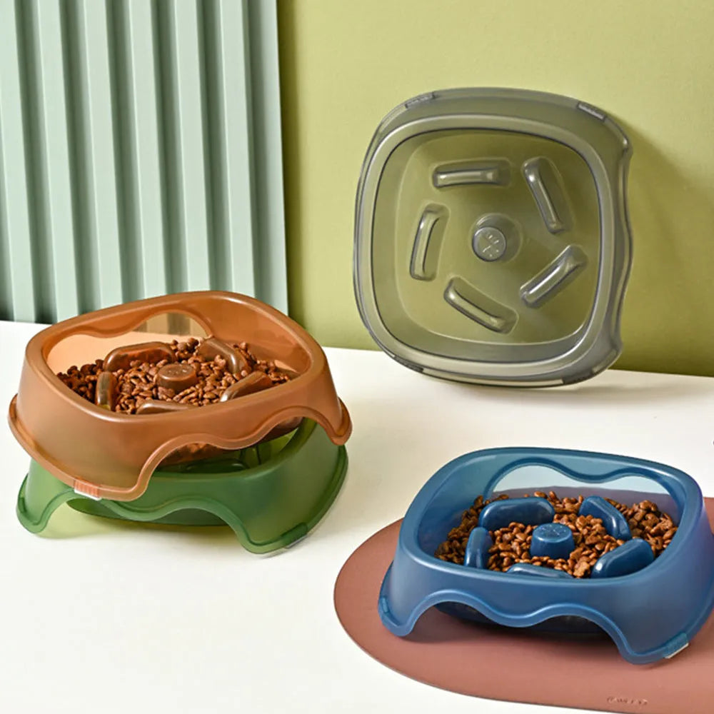 Blue plastic dog slow feeder bowl with anti-choking design on a white background