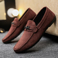Men's black and brown waterproof slip-on loafers with round toe and rubber sole.
