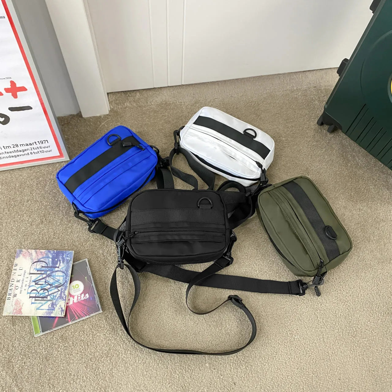 Men's solid color polyester nylon messenger bag with sewing thread detail and crossbody strap in black blue green or white