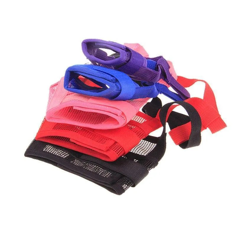 A black adjustable plastic dog muzzle shown on a size chart with options for red, blue, pink, and purple.