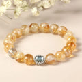 Geometric citrine crystal bracelet with 10mm polished stones on wrist