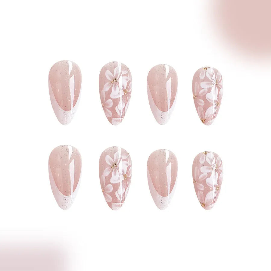 Short almond shaped false nails with glossy finish and glitter flower French tip design colour C625