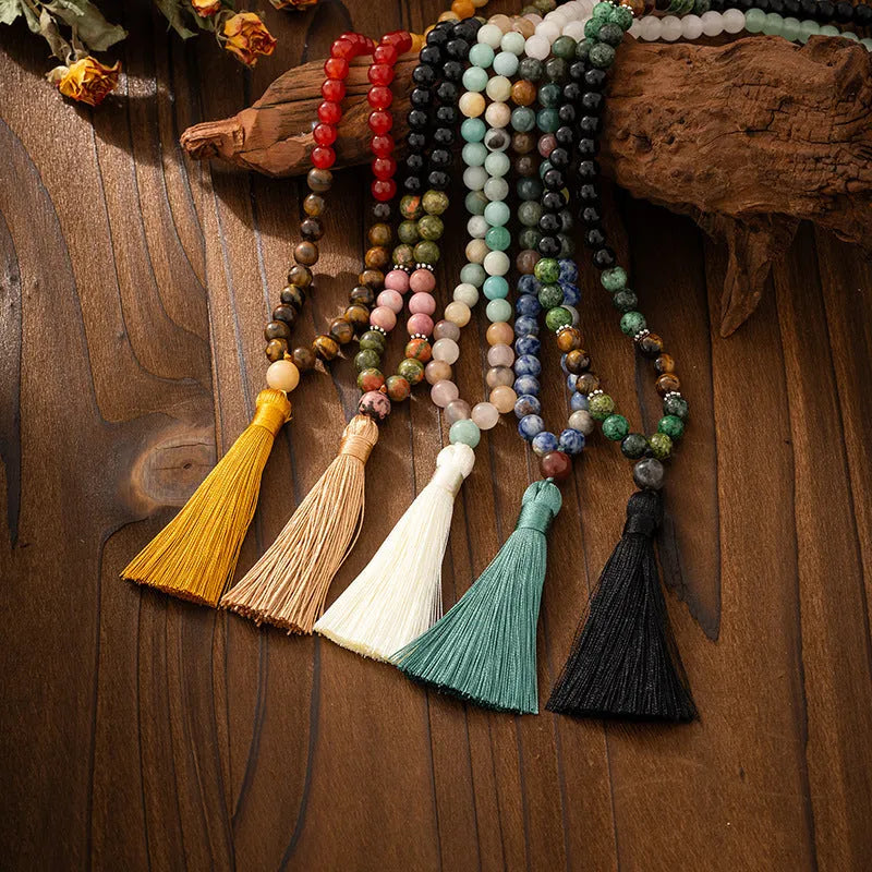 Vintage bohemian style beaded sweater chain with geometric beads and tassel pendant, shown with matching bracelet