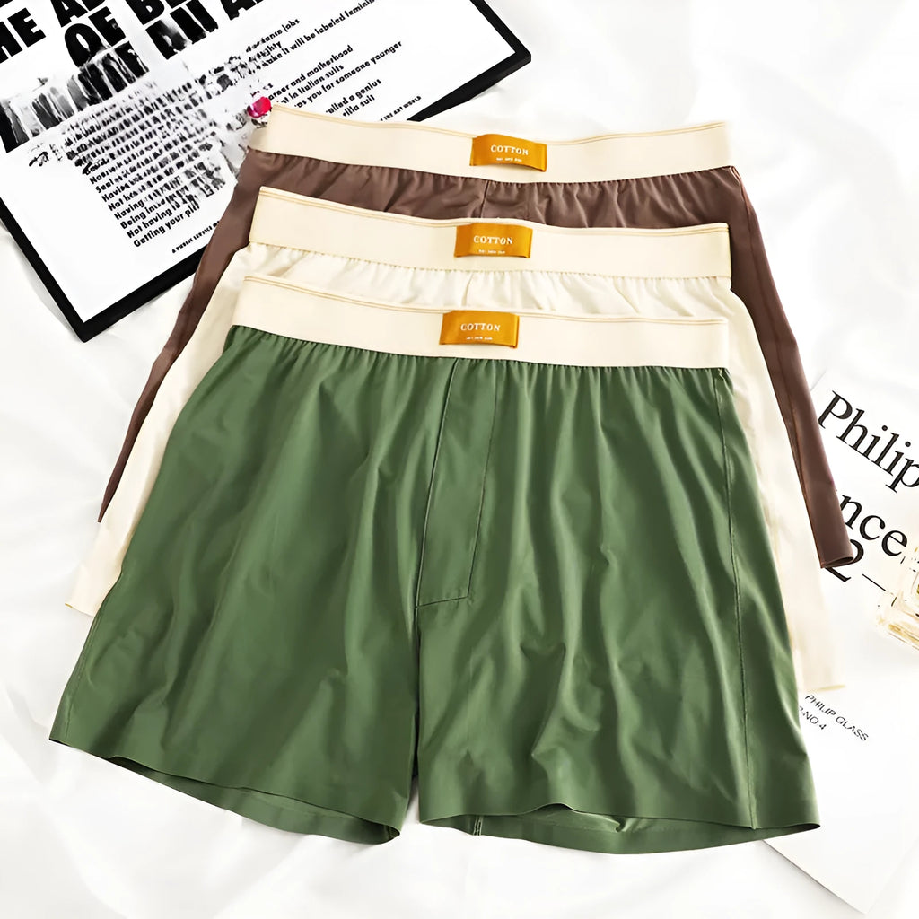 Three pairs of men's solid colour loose fit ice silk underwear in various colour combinations
