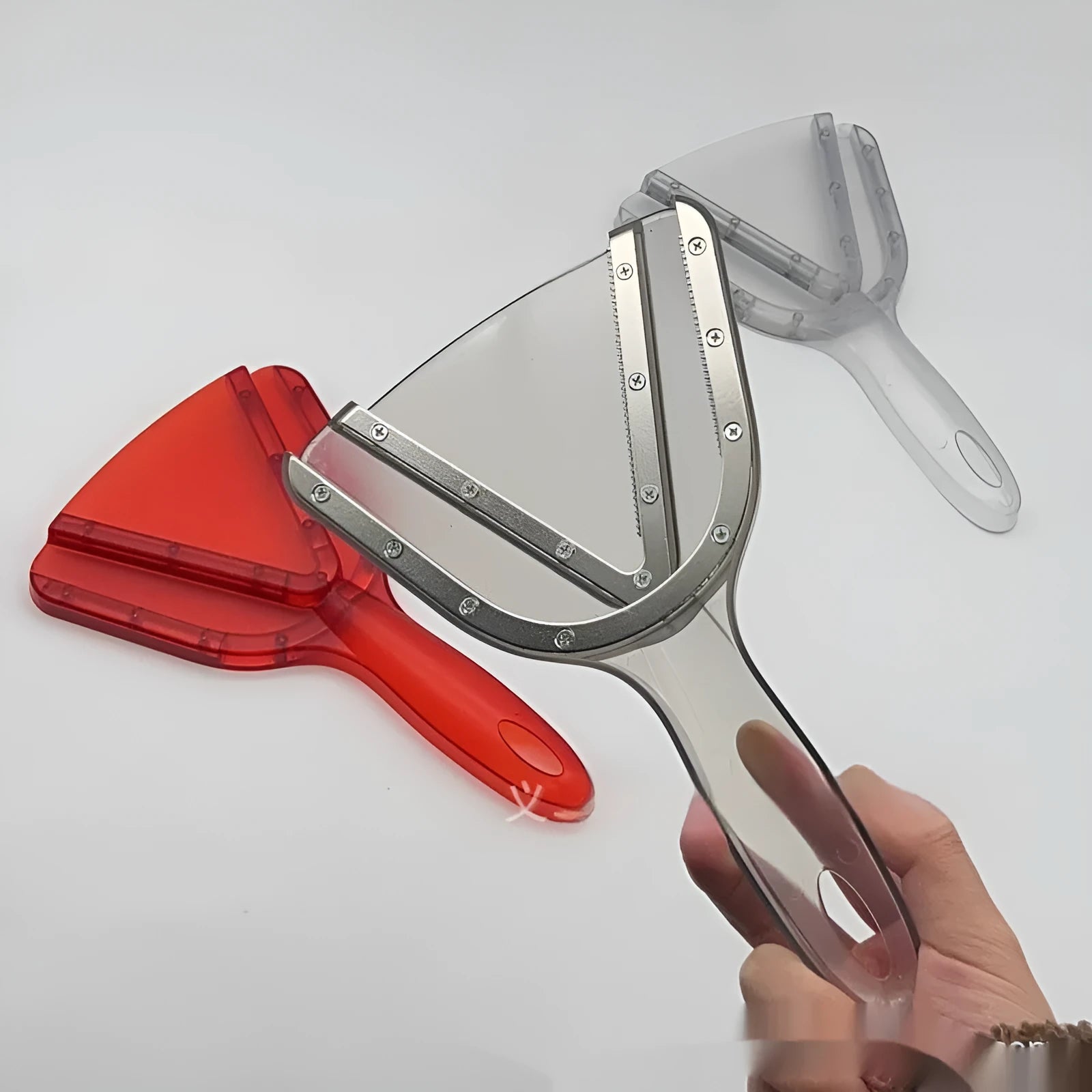 A red adjustable telescopic can and bottle opener with a non-slip handle on a white background.