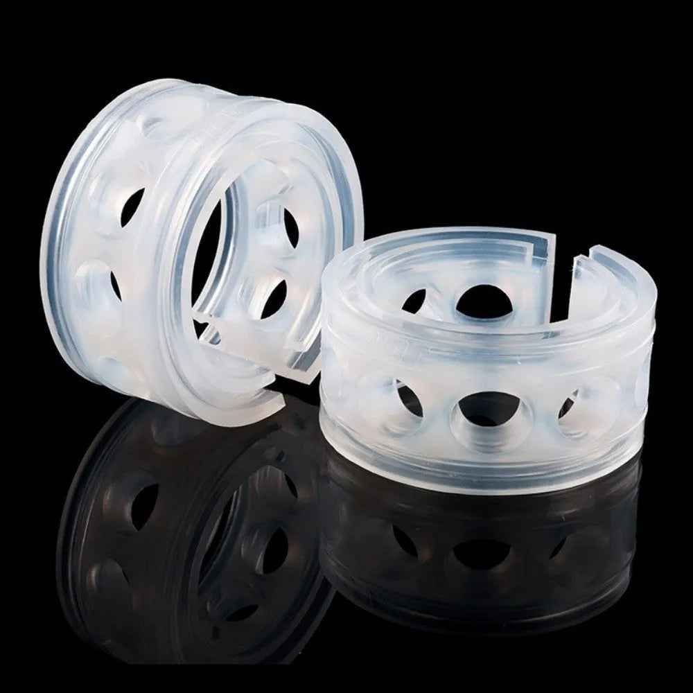 Transparent rubber shock absorber buffers for car springs in six sizes with visible spring gap.