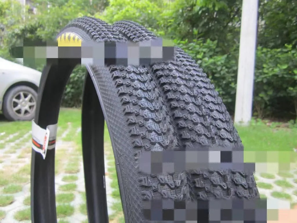 Ultralight mountain bike tyre with reinforced sidewall, shown in a 29x2.1 size with white label.
