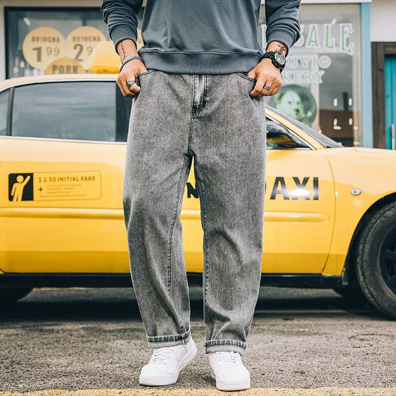 Men's loose straight jeans in dark blue, light blue, and grey colours showing mid waist and straight-leg cut