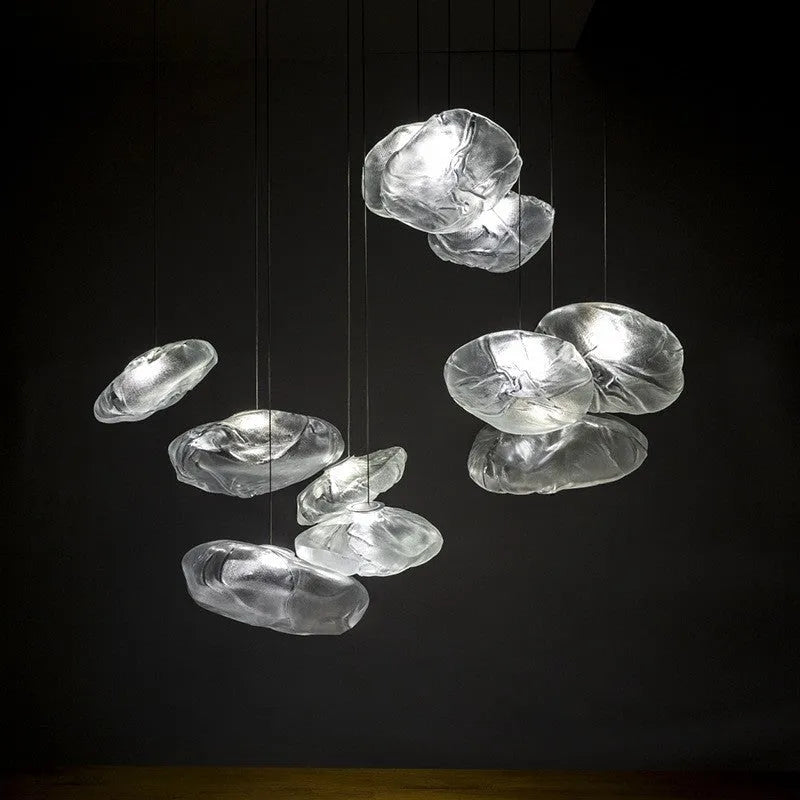 Modern glass decorative chandelier light fixture in amber, clear or smoke grey colour.
