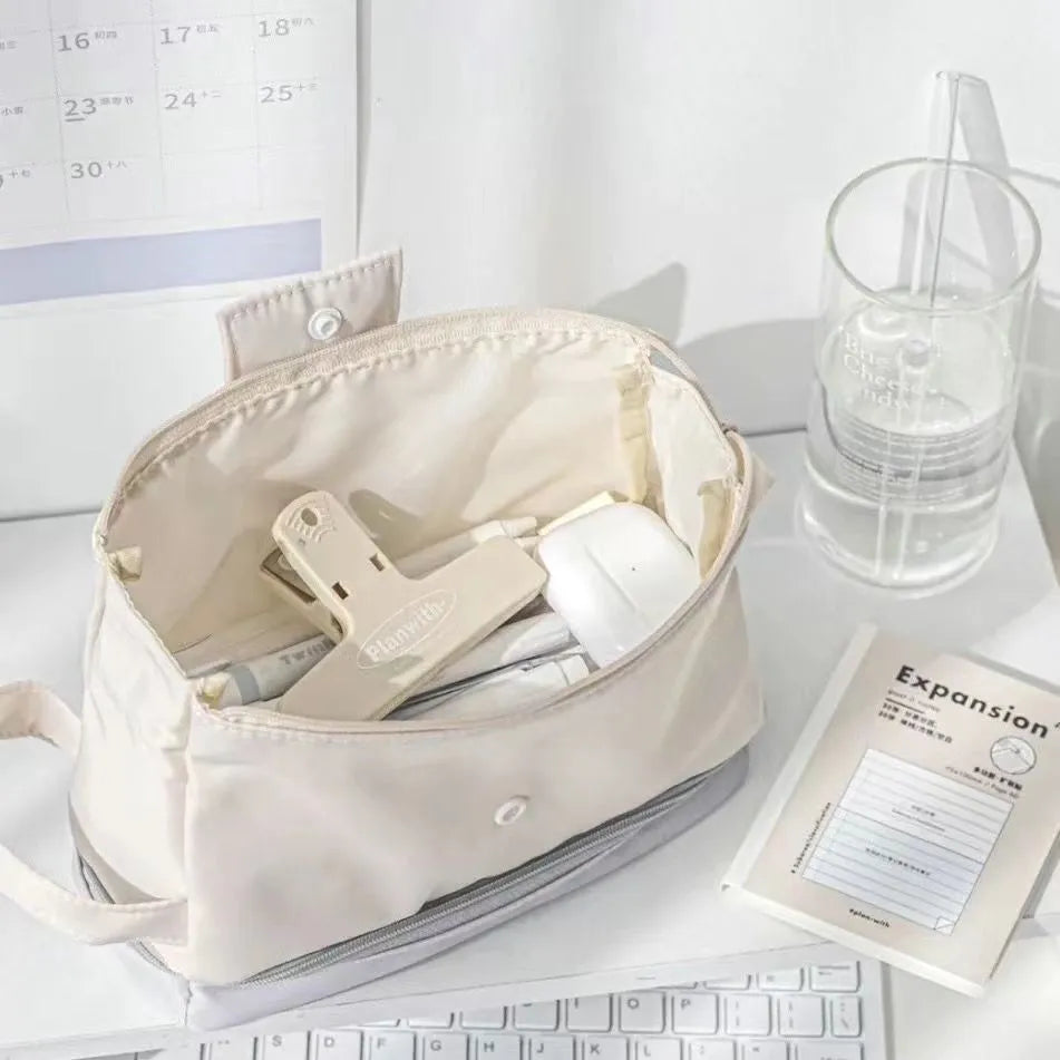 Polyester folding double-layer pencil case in dark blue, blue, and cream white colour options.