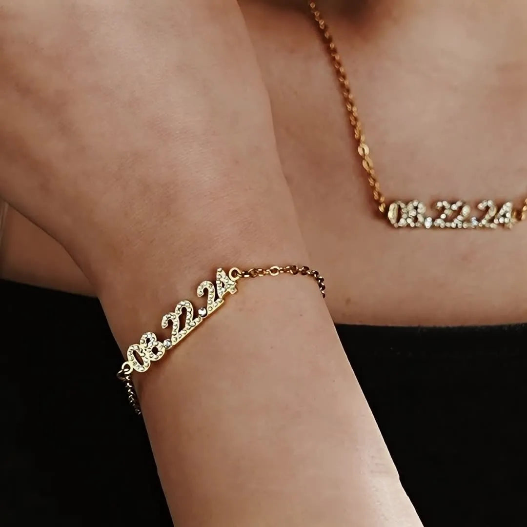 Stainless steel digital bracelet with diamond-studded face on a wrist.