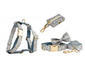 Blue floral pattern dog collar accessories set with adjustable collar, matching leash, bow, vest, and poop bag