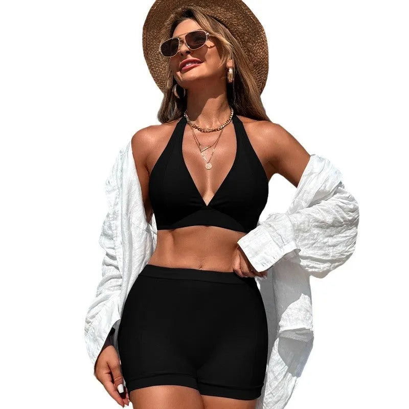 Black women's split bikini swimsuit with adjustable ties on a mannequin