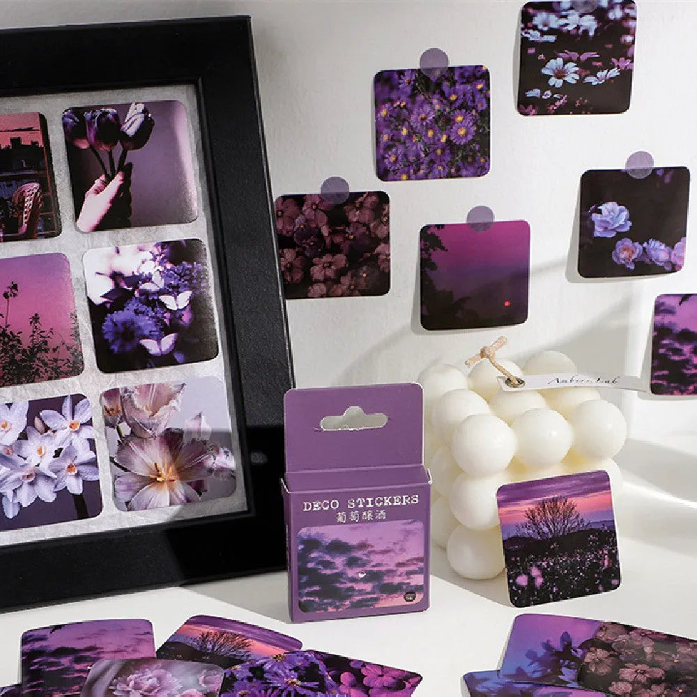 Box of Nordic-themed decorative stickers showing designs like flowers, roses, and sunset scenes, each sticker 44mm square.