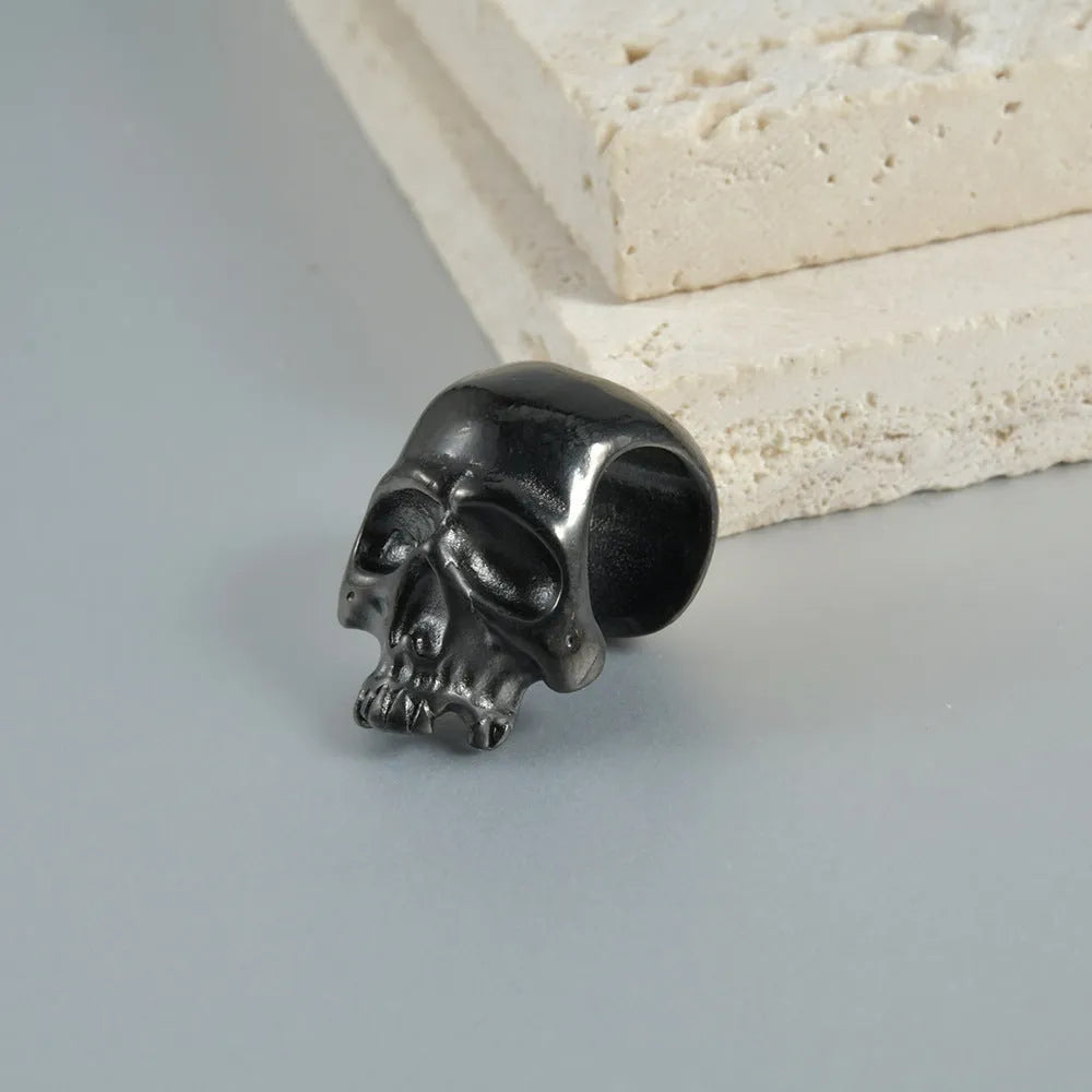 Hollow skull Buddha stainless steel earrings with geometric hip hop styling in auricle piercing design
