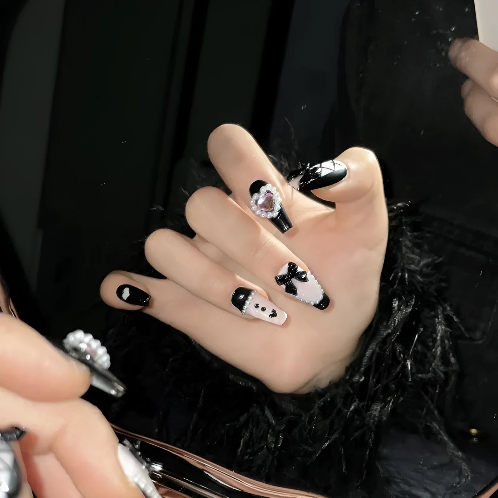 Black peach heart hand-painted false nails with cat's eye style and bow patterns