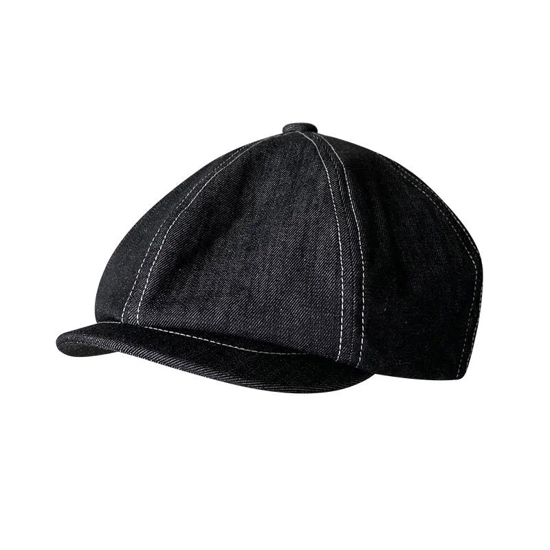 Black cotton beret with an octagonal cap style on a neutral background.