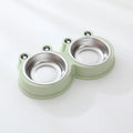 Stainless steel double pet bowl with frog-shaped non-slip base in blue, green, and pink colours