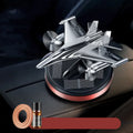 Solar powered silver rotating fighter jet model perfume ornament for car dashboard.