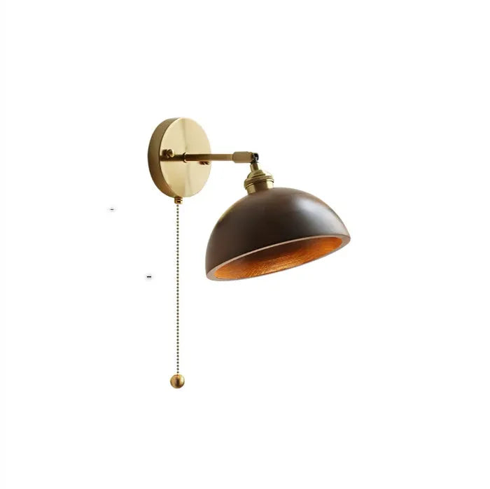 Nordic style wooden bedside wall lamp in walnut colour mounted on a wall.