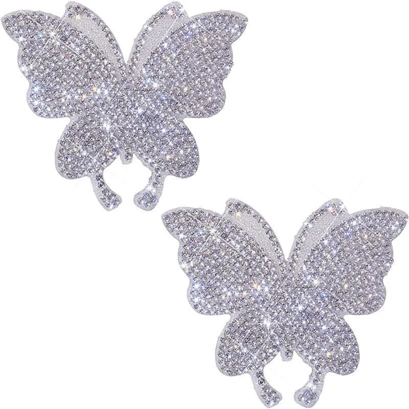 Close-up of white diamond series glass car sticker featuring butterfly and bear paw design measuring 7cm by 6cm