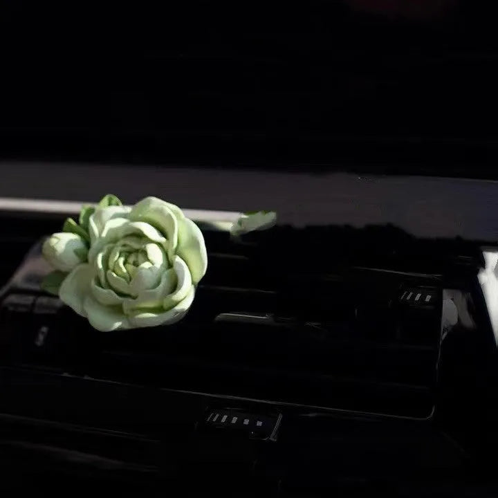Solid jasmine car air freshener with gypsum construction for vehicle vents