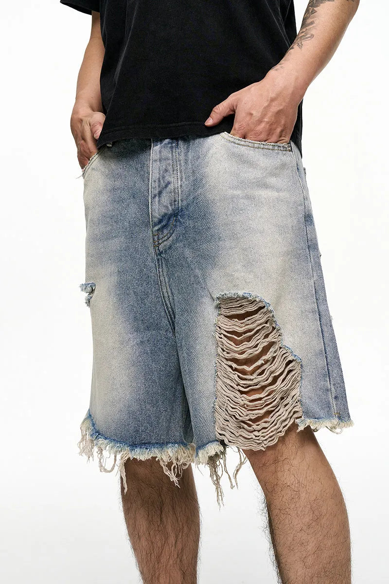 Men's light blue baggy denim shorts with a retro washed finish on a mid-waist