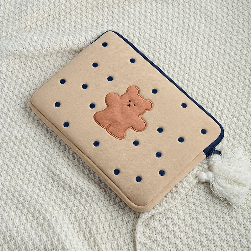 Embroidered laptop sleeve with animal design showing polyester construction and laptop size compatibility