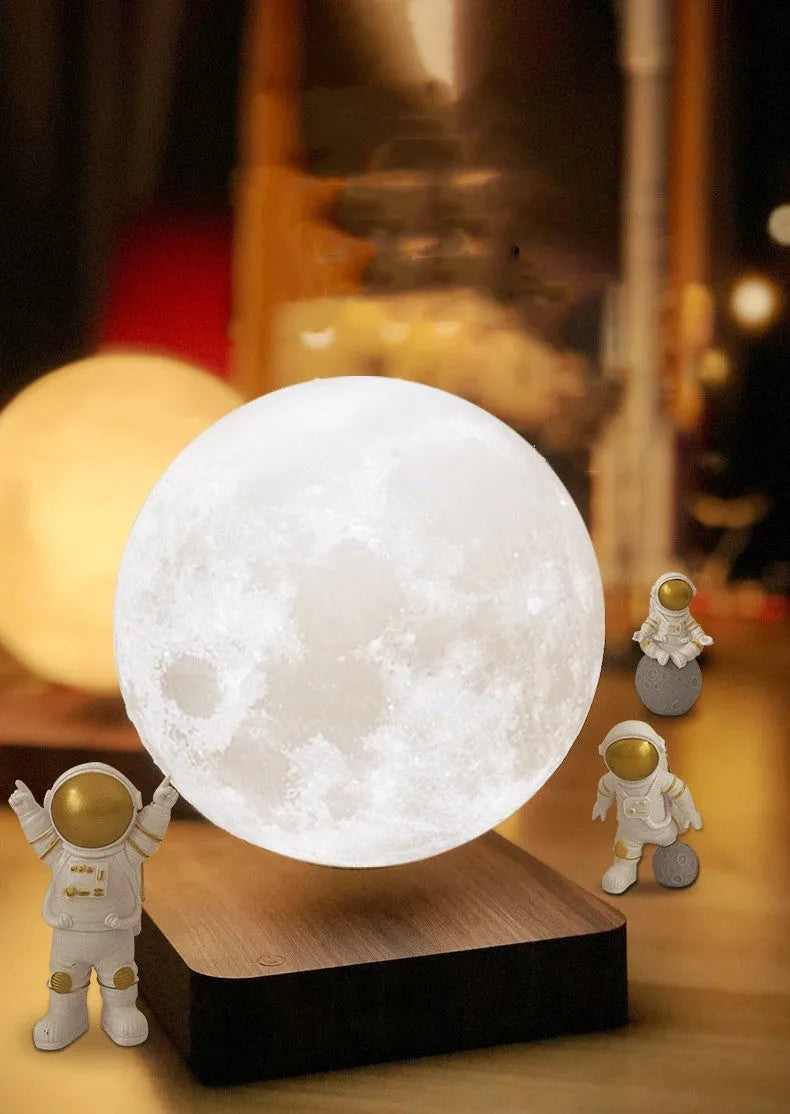 Maglev floating planet night light hovering above its base, showing a choice of Jupiter, Mars, Saturn, Earth and Moon designs.