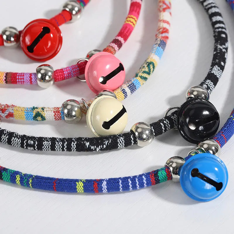 Coloured ethnic pattern adjustable pet collar with a bell for a dog or cat.