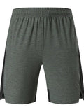 Men's forest green spandex five-point shorts with mid-waist and short leg design laid flat.