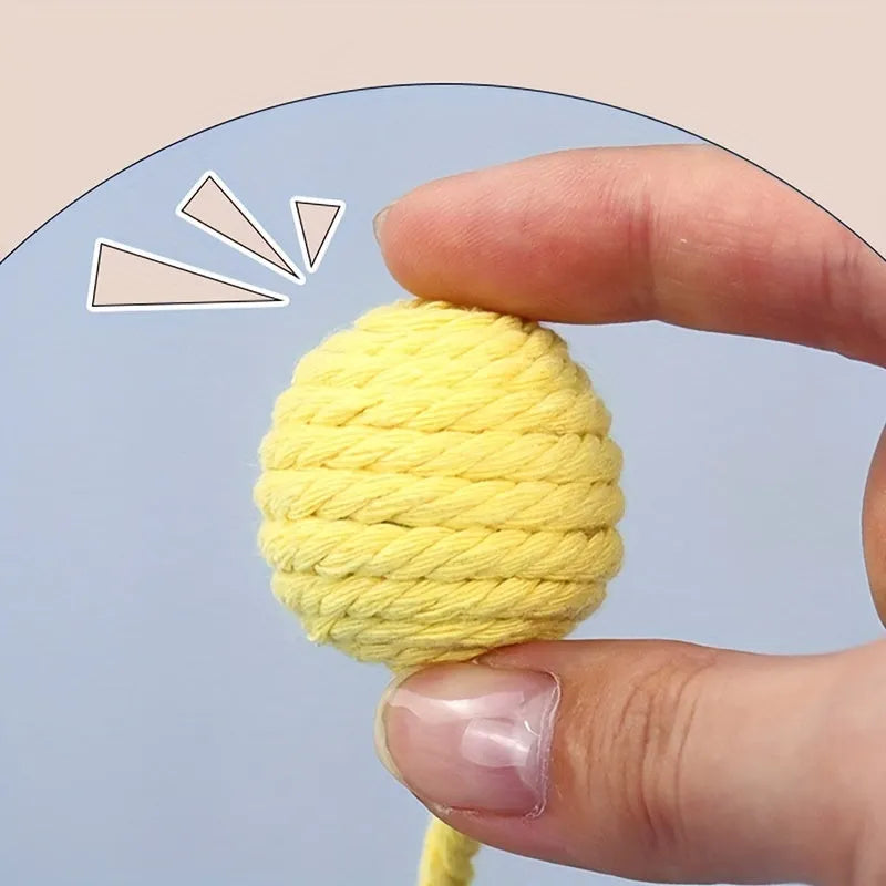 Colourful cat toy ball with rope attachment and built-in bell for interactive play