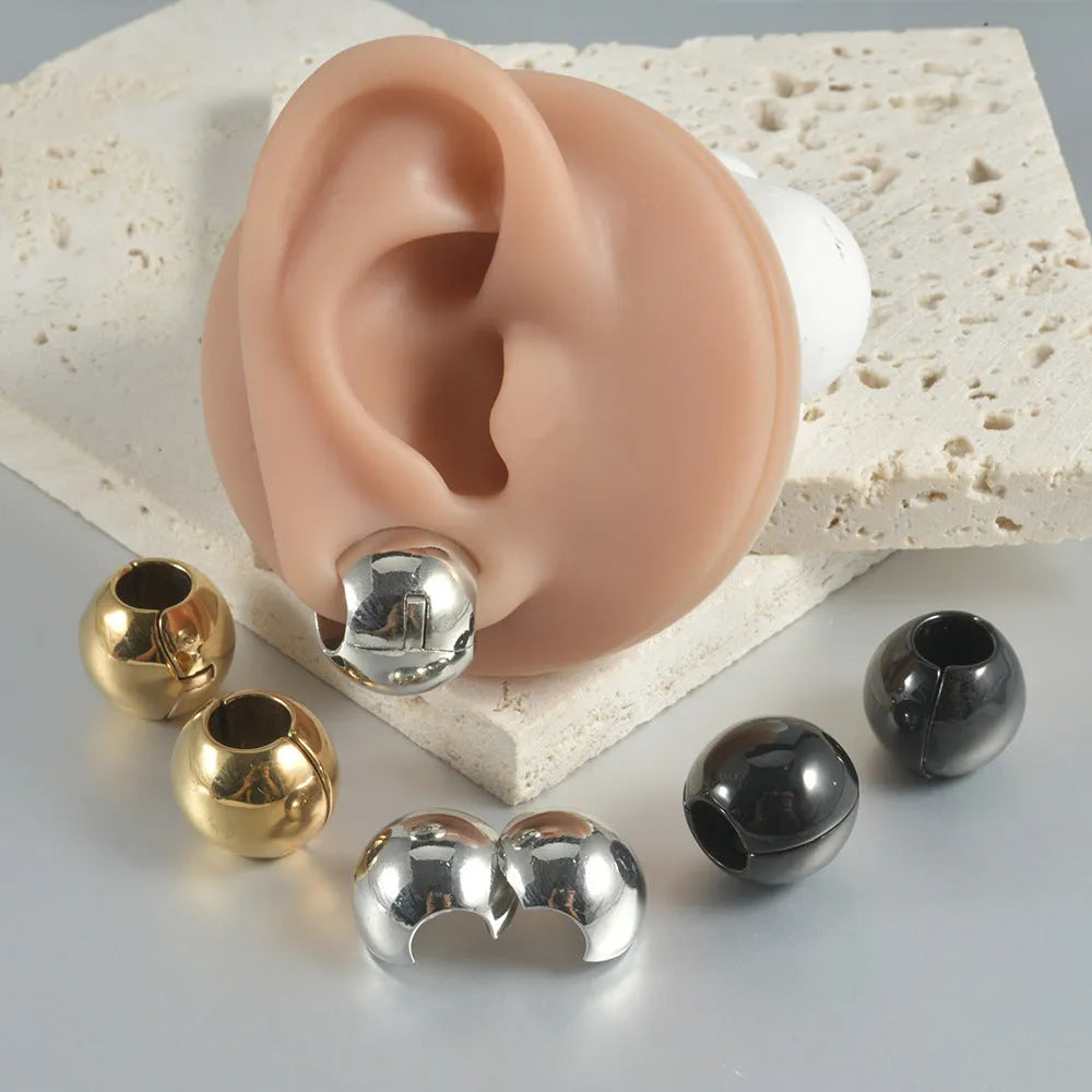 Hollow skull Buddha stainless steel earrings with geometric hip hop styling in auricle piercing design
