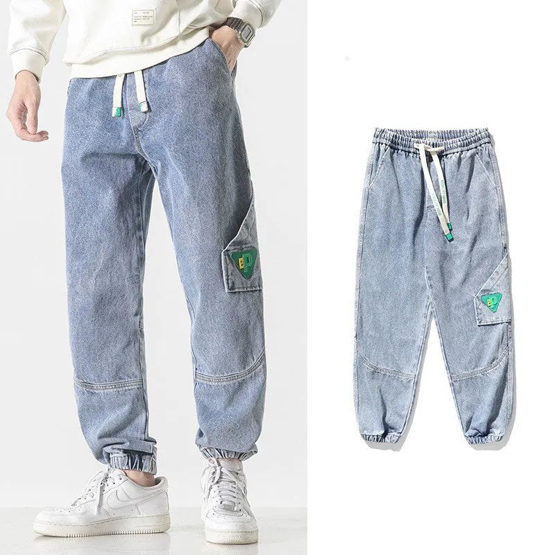 Men's loose-fit tapered cotton trousers in black, blue or grey with mid-waist design