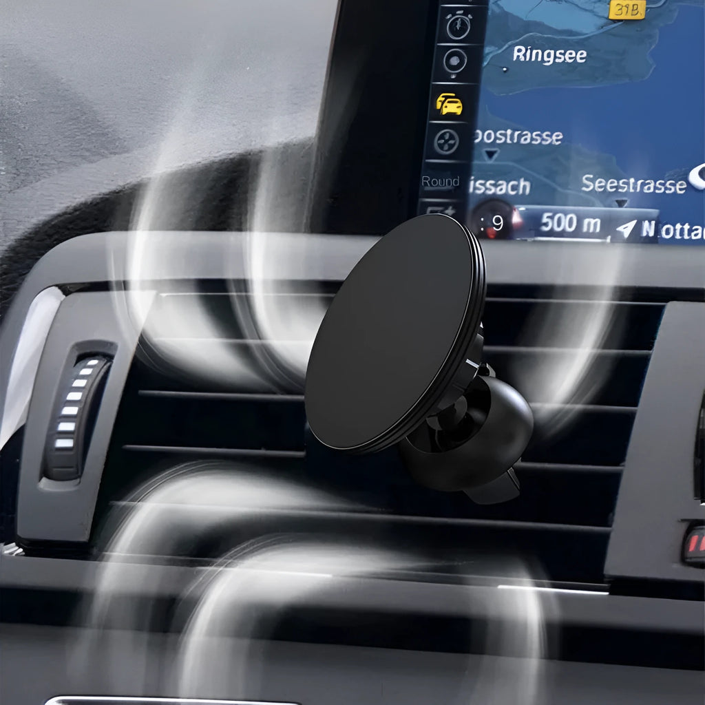 Black aluminium alloy magnetic phone holder attached to a car's circular air vent.