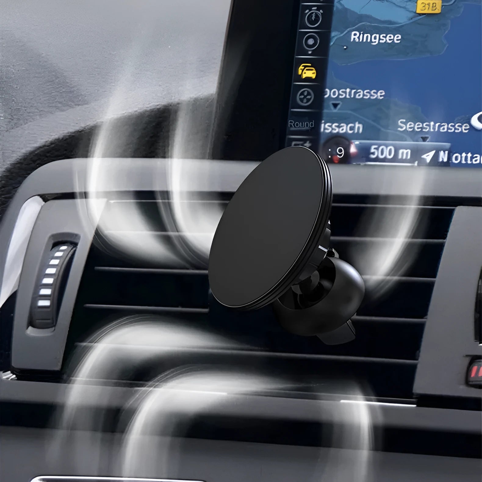 Black aluminium alloy magnetic phone holder attached to a car's circular air vent.