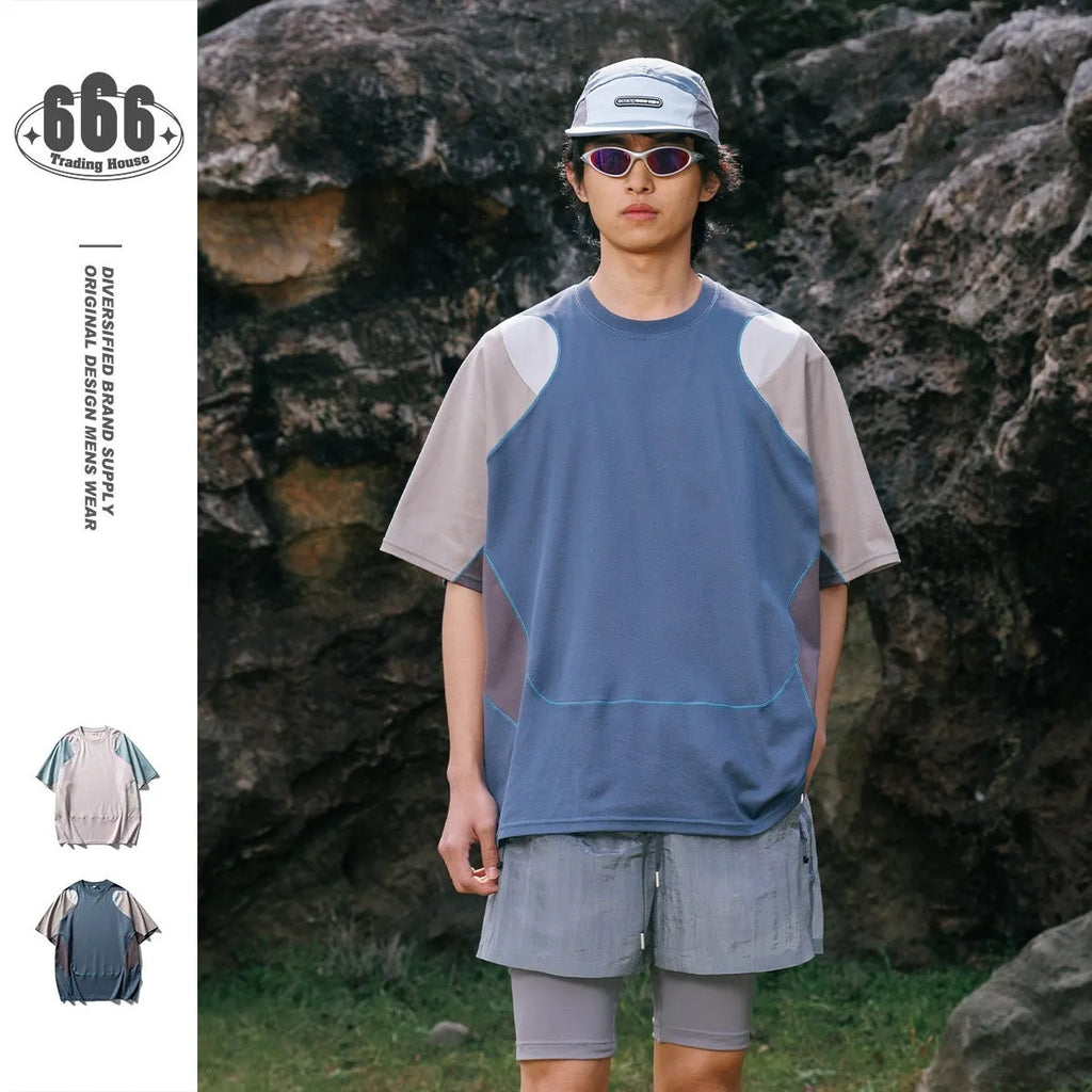 Man wearing a loose-fit patchwork contrast colour short sleeve cotton blend sports t-shirt.