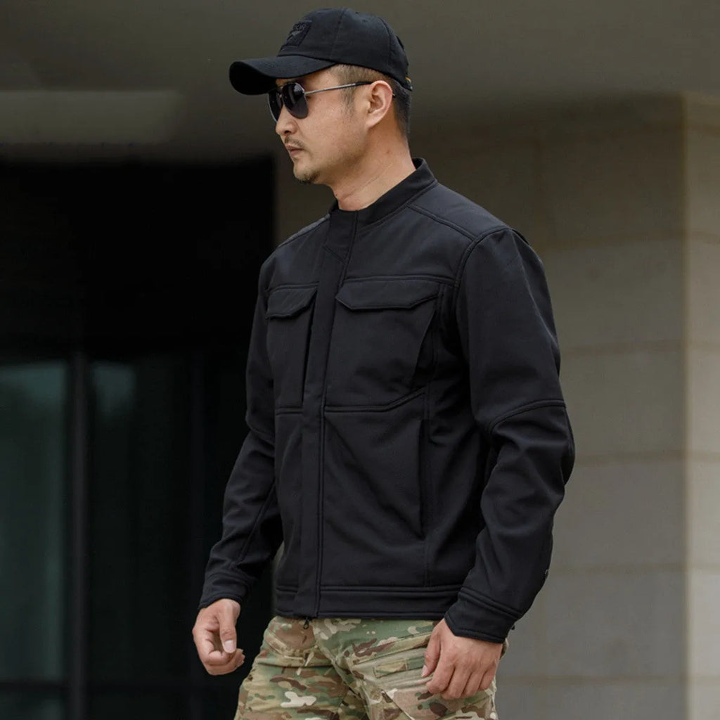 Bone Frog Peak Breaker black soft shell tactical jacket shown on model for mountaineering.