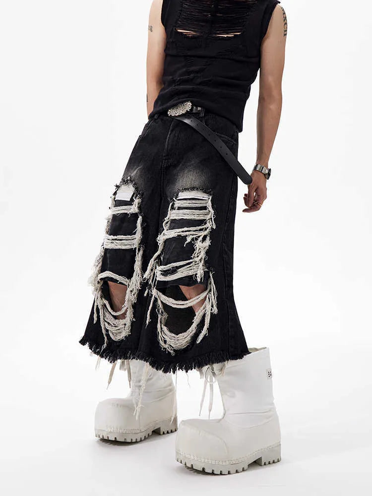 Black cropped wide-leg women's jeans with ripped patch details and mid-high waist