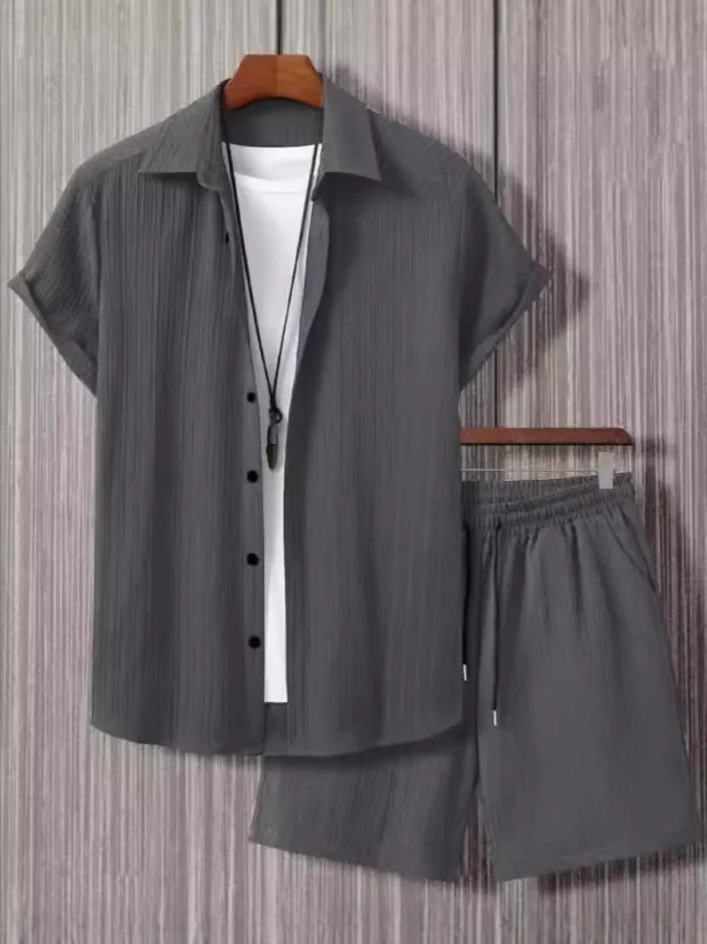 Jacquard patterned short sleeve shirt and matching shorts suit set on a hanger.