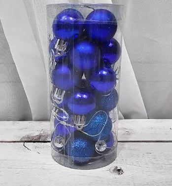 Assorted gold, red, silver and blue 3cm diameter shiny matte Christmas baubles displayed together.