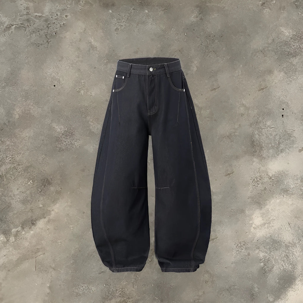 Men's wide leg denim trousers in original cow colour, showing mid waist and loose leg fit.