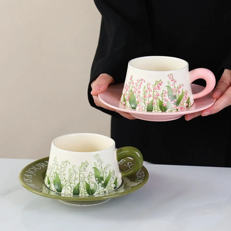 Ceramic coffee cup and saucer set with two cups, two saucers and two stirring spoons