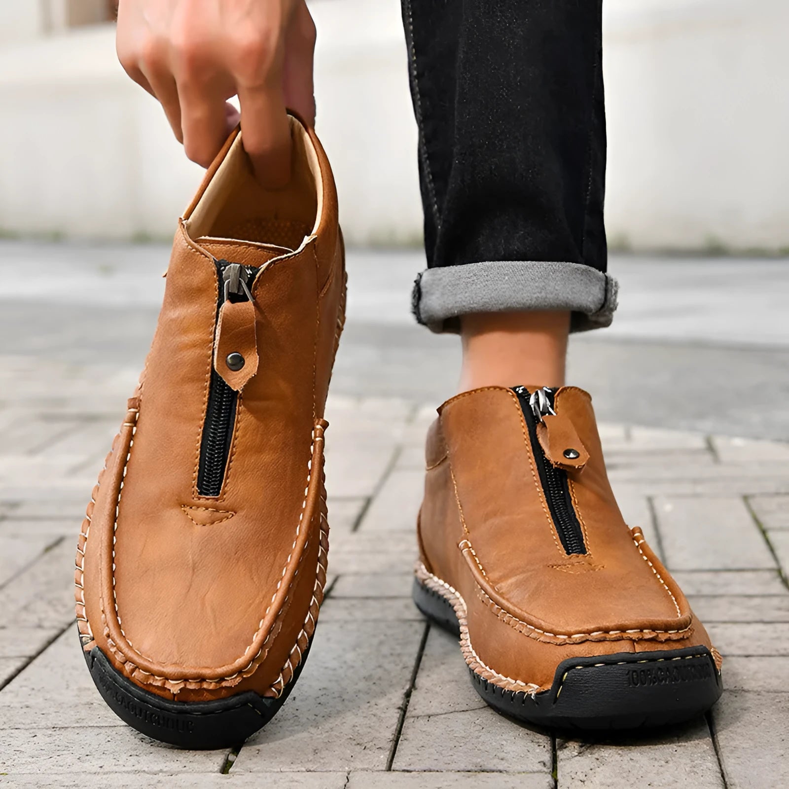 Men's leather slip-on loafers in black brown or grey colours showing round toe and rubber sole design