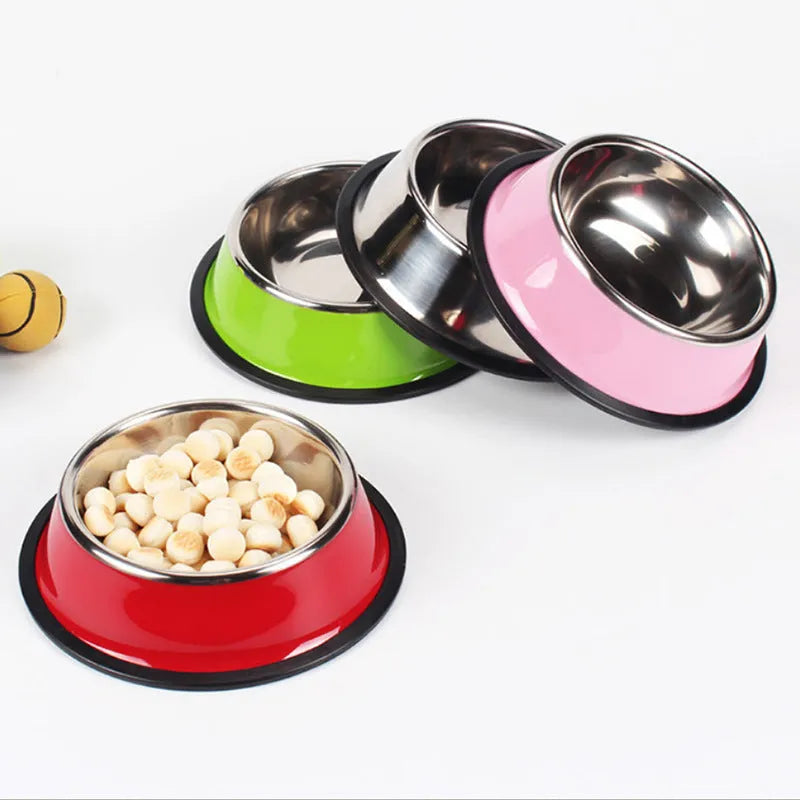 Stainless steel pet bowl inside a colourful melamine bowl, showing non-slip rubber base, in orange colour.
