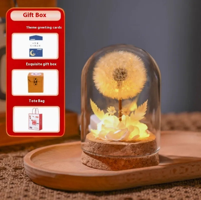 Dandelion glass night light ornament with gradient colour options on wooden surface