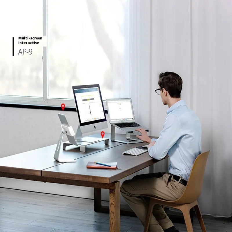 Black aluminium alloy laptop stand on desk elevating computer for ergonomic use