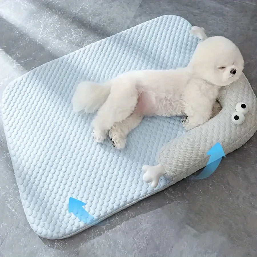 Blue and yellow monster face design pet bed for dogs and cats on a wooden floor